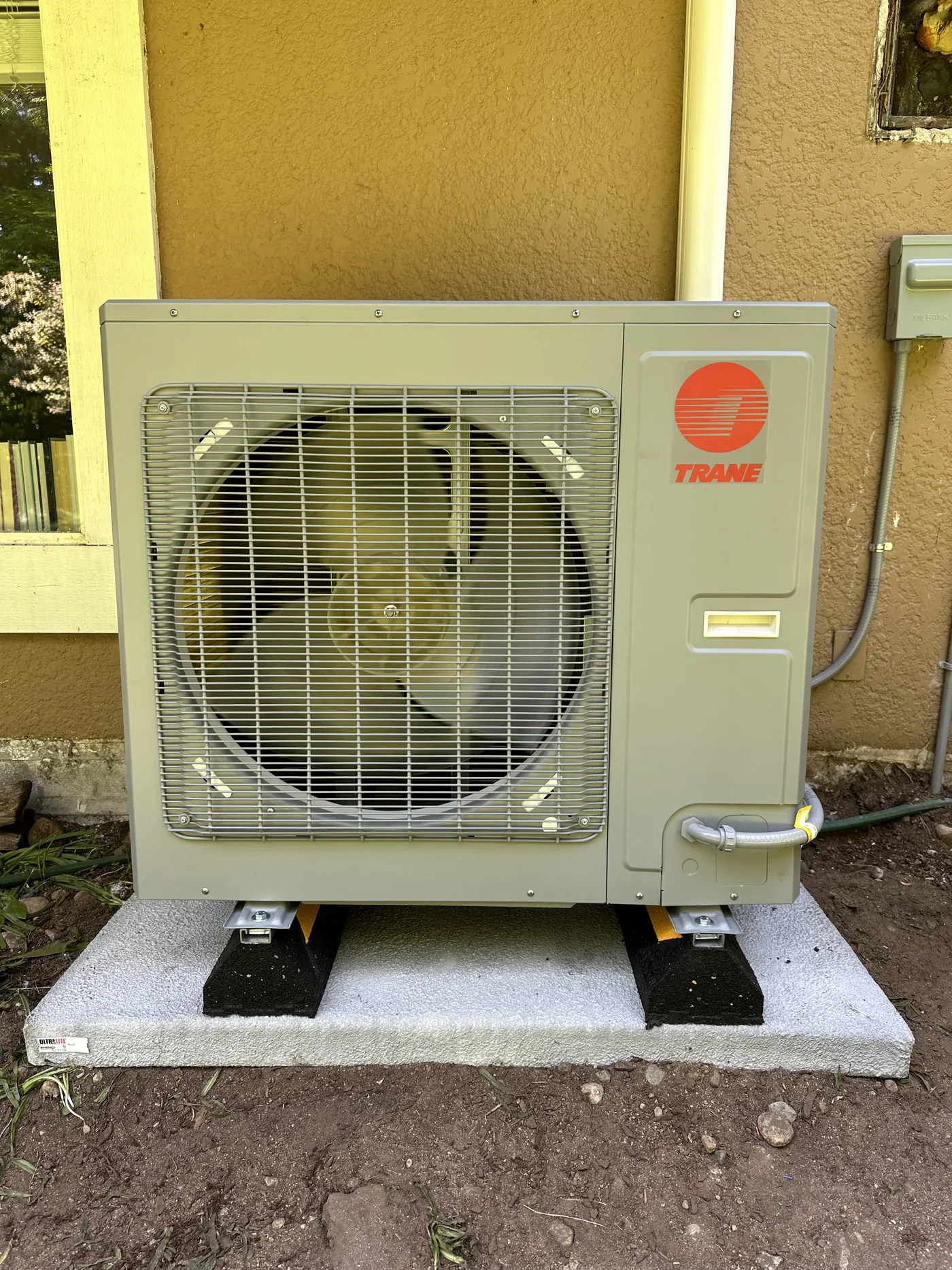 Compact Trane unit set on vibration-absorbing mounts