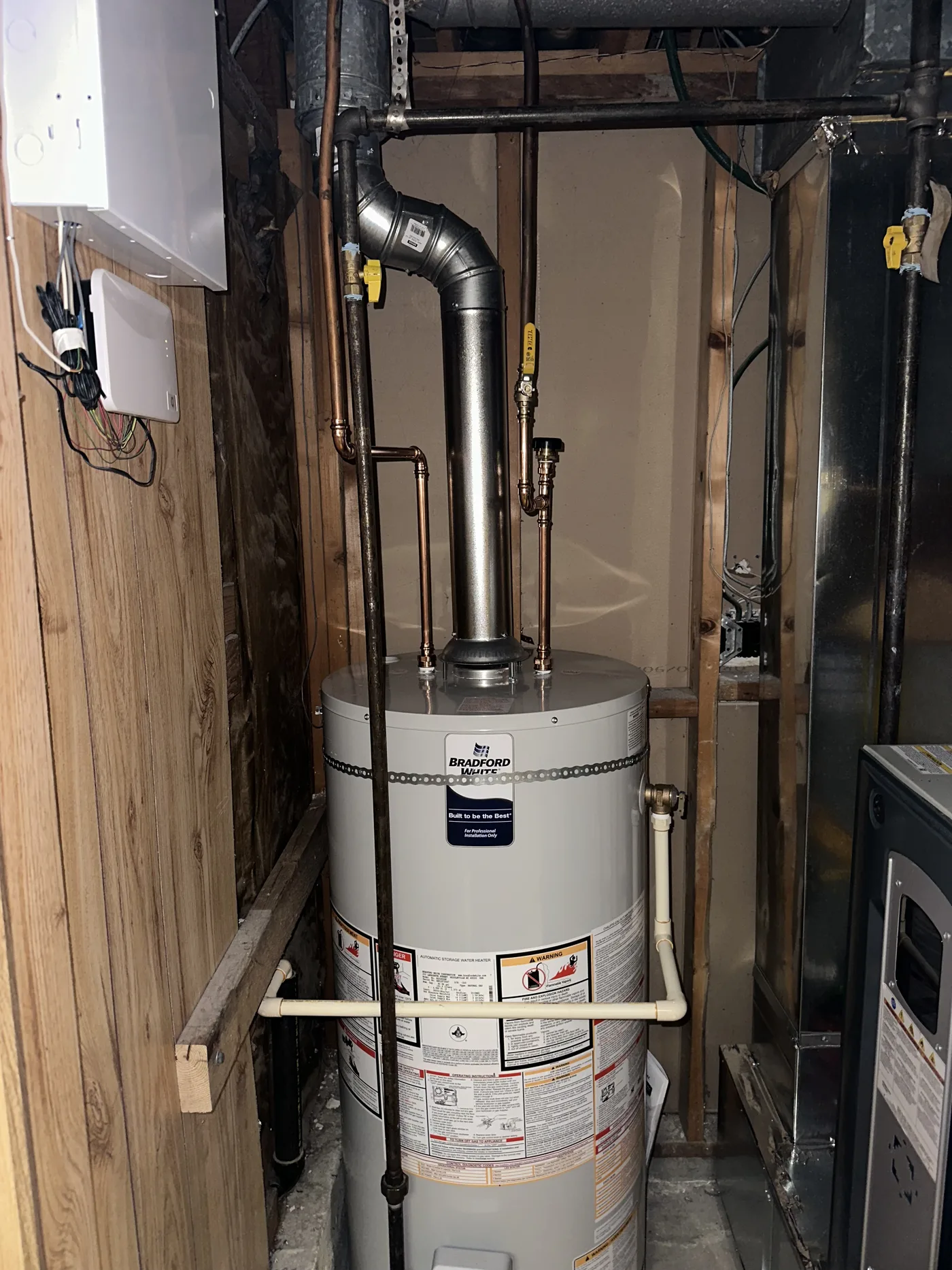 Gas hot water tank replaced in a tight utility closet